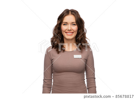 happy female shop assistant with name tag happy female shop assistant with name tag 85678817