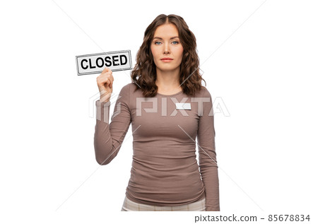 female shop assistant with closed sign female shop assistant with closed sign 85678834