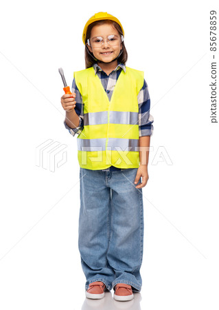 girl in helmet and safety vest with screwdriver girl in helmet and safety vest with screwdriver 85678859