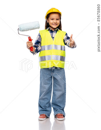 girl in helmet with paint roller showing thumbs up girl in helmet with paint roller showing thumbs up 85678860