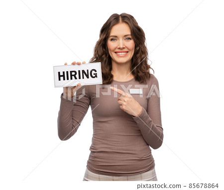 happy female shop assistant with hiring banner happy female shop assistant with hiring banner 85678864