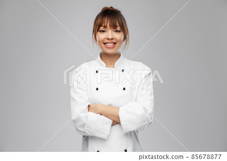 smiling female chef in white jacket 85678877