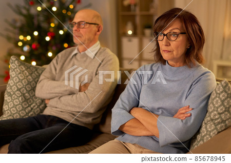 unhappy senior couple at home on christmas unhappy senior couple at home on christmas 85678945