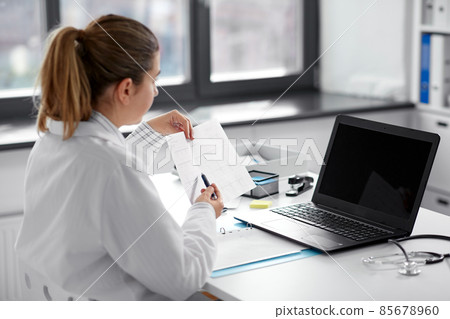 doctor with laptop having video call at hospital doctor with laptop having video call at hospital 85678960