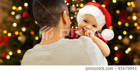 happy father and baby girl over christmas tree happy father and baby girl over christmas tree 85679043