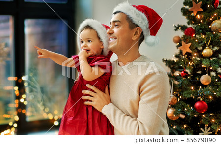 father and baby daughter on christmas at home father and baby daughter on christmas at home 85679090