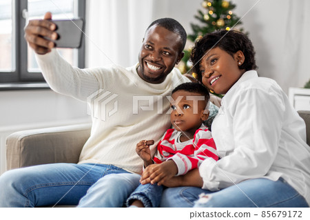 african family taking selfie on christmas at home african family taking selfie on christmas at home 85679172