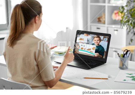 art teacher and student boy on laptop with picture 85679239