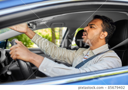 angry indian man or driver driving car angry indian man or driver driving car 85679402