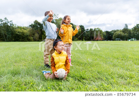 happy children with soccer ball at park happy children with soccer ball at park 85679734