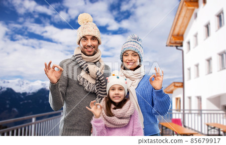 happy family showing ok gesture in winter happy family showing ok gesture in winter 85679917