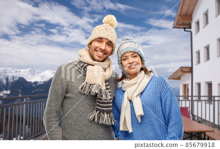 couple over mountains and ski resort in winter 85679918