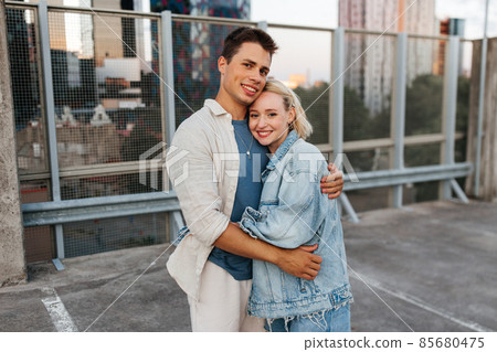 happy couple hugging on roof top city parking happy couple hugging on roof top city parking 85680475