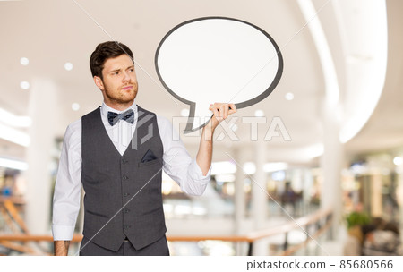 man in suit holding text bubble at shopping mall man in suit holding text bubble at shopping mall 85680566