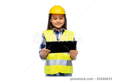 girl in helmet and safety vest with tablet pc 85680635
