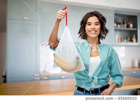 happy woman with bananas in reusable string bag happy woman with bananas in reusable string bag 85680910