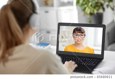 student woman in headphones with laptop and book student woman in headphones with laptop and book 85680911