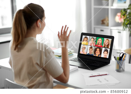 teacher with laptop having online class at home teacher with laptop having online class at home 85680912