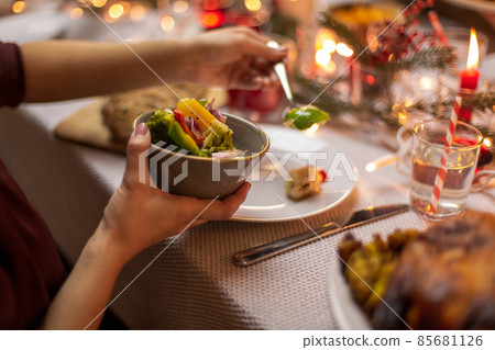 female hands with food at christmas dinner 85681126