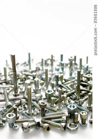 Assembly of bolts and nuts (machine parts image / vertical composition) 85681886