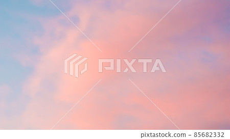 Background of blue sky with pale pink clouds in sunset 85682332
