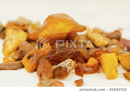 Amber. There are many different transparent pieces of amber, small and large, Ancient wood resin as a mineral for jewelers. The Sunstone 85683592