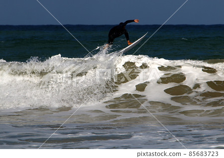 Surfing big waves in the Mediterranean Sea off the northern coast of Israel Surfing big waves in the Mediterranean Sea off the northern coast of Israel 85683723
