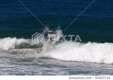 Surfing big waves in the Mediterranean Sea off the northern coast of Israel 85683738