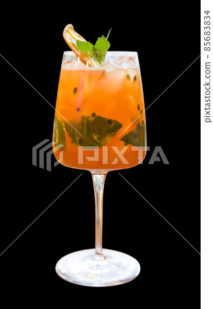 Die cut of cocktail passion fruit juice cold refreshing drink on black isolated. Die cut of cocktail passion fruit juice cold refreshing drink on black isolated. 85683834