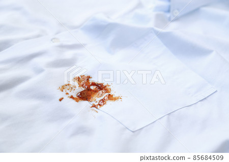 dirty barbeque sauce stain on cloth from daily life activity for cleaning concept. housework care living life of people dirty barbeque sauce stain on cloth from daily life activity for cleaning concept. housework care living life of people 85684509
