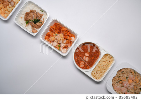 Above view of various frozen meal against on white background. 85685492