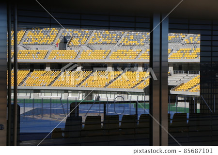 Audience seats in the stadium through the glass 85687101