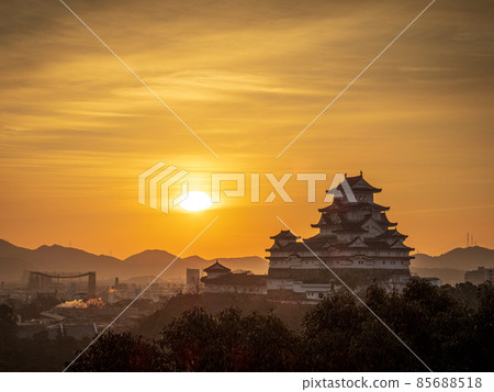 A view of Himeji Castle dyed by the sunrise and orange sunrise A view of Himeji Castle dyed by the sunrise and orange sunrise 85688518
