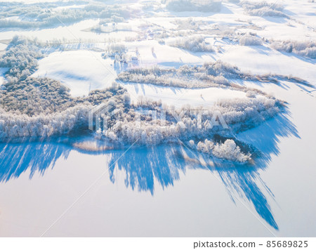 Fabulous aerial winter landscape background of frost on branches, extremely cold environment conditions, cold winter day with sunlight Fabulous aerial winter landscape background of frost on branches, extremely cold environment conditions, cold winter day with sunlight 85689825