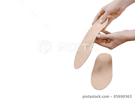 Orthopedic insole isolated on a white background. Medical insoles. Treatment and prevention of flat feet and foot diseases. Foot care, feet comfort. Wear comfortable shoes. Flat Feet Correction. 85690363