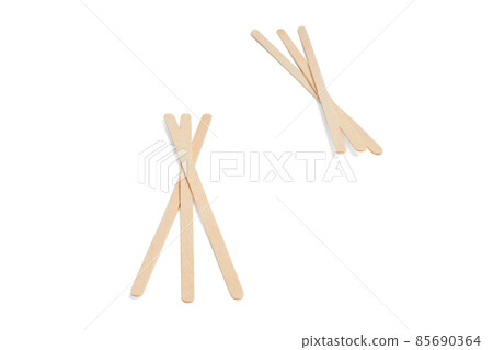 Disposable stick for coffee isolated on white background. Wooden stirrer sticks. Stir sticks for hot drinks. Coffee and tea spoon, zero waste. Popsicle elements for holding ice cream. 85690364