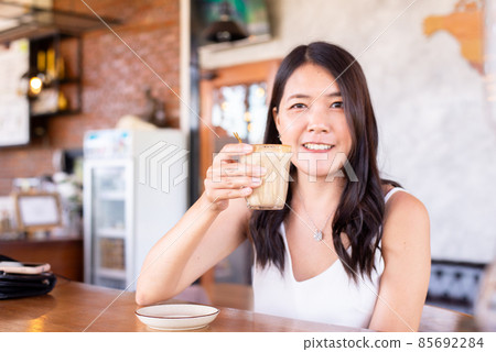 Beautiful asian woman drinking coffee in modern cafe,Take a coffee break Beautiful asian woman drinking coffee in modern cafe,Take a coffee break 85692284