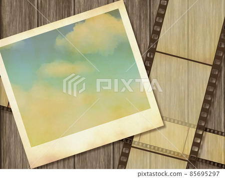Retro Polaroid inset photo and negative film frame (dark wood table background) 85695297