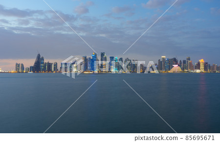 Doha city skyline illuminated at night. Qatar Middle East Doha city skyline illuminated at night. Qatar Middle East 85695671