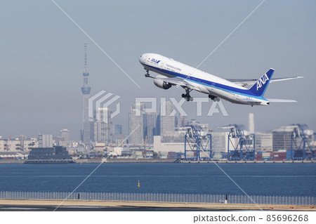 Aircraft taking off against the backdrop of Tokyo Sky Tree and skyscrapers Haneda Airport, Ota-ku, Tokyo 85696268