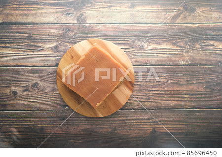 Jaggery traditional cane sugar cube on table  85696450