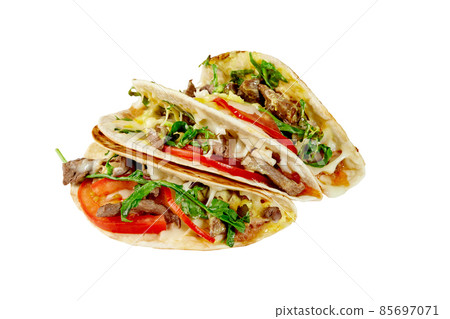 Tacos with beef, cheese sauce, arugula, tomatoes, mozzarella, bacon jam isolated on white Tacos with beef, cheese sauce, arugula, tomatoes, mozzarella, bacon jam isolated on white 85697071