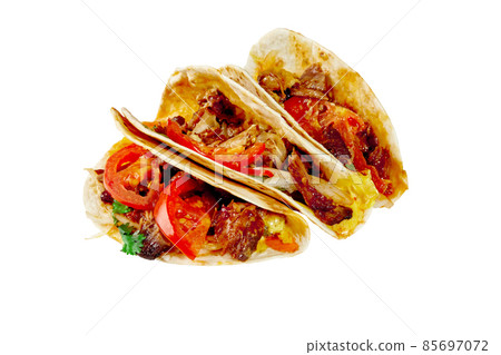 Tacos with ribs, pickled onions, fresh tomatoes and sauces isolated on white 85697072