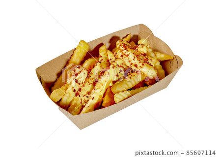 French fries in cardboard container with cheese sauce and fried bacon crumbs French fries in cardboard container with cheese sauce and fried bacon crumbs 85697114