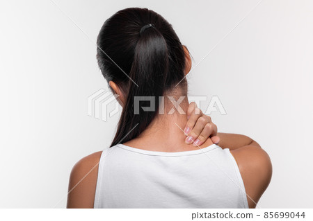 Rear view of woman suffering from office syndrome Rear view of woman suffering from office syndrome 85699044
