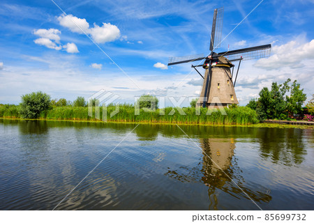A windmill in Kinderdijk, Holland, Netherlands A windmill in Kinderdijk, Holland, Netherlands 85699732