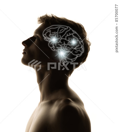 Contemporary artwork. Silhouette of young man with neon drawings of brain in his head. Artwork. Artificial intelligence concept 85700077