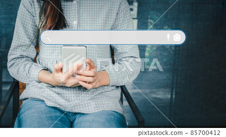 Adult woman using smartphone in the cafe for searching browsing internet data information. Business concept for Using search with your website. 85700412