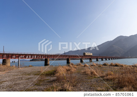 Kyoto Word Railway running on the Yura River Bridge 85701061