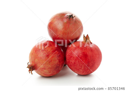 Ripe pomegranate fruits isolated on white background Ripe pomegranate fruits isolated on white background 85701346